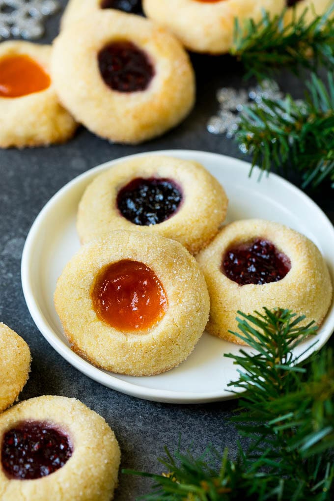 Thumbprint Cookies | Sugar Cookies #cookies #baking #christmas #dessert #sraye A plate of jam filled thumbprint cookies.