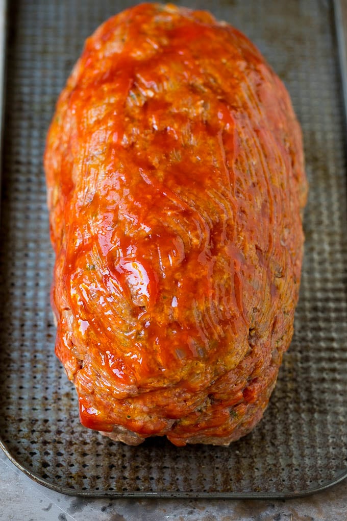 Bacon Wrapped Meatloaf Recipe | Beef Meatloaf #meatloaf #beef #groundbeef #bacon #dinner #sraye Ground beef shaped into a loaf and coated in ketchup.