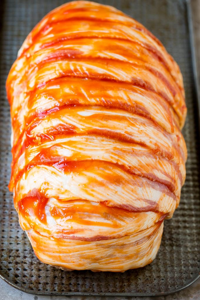 Bacon Wrapped Meatloaf Recipe | Beef Meatloaf #meatloaf #beef #groundbeef #bacon #dinner #sraye Raw slices of bacon wrapped around a seasoned ground beef loaf.