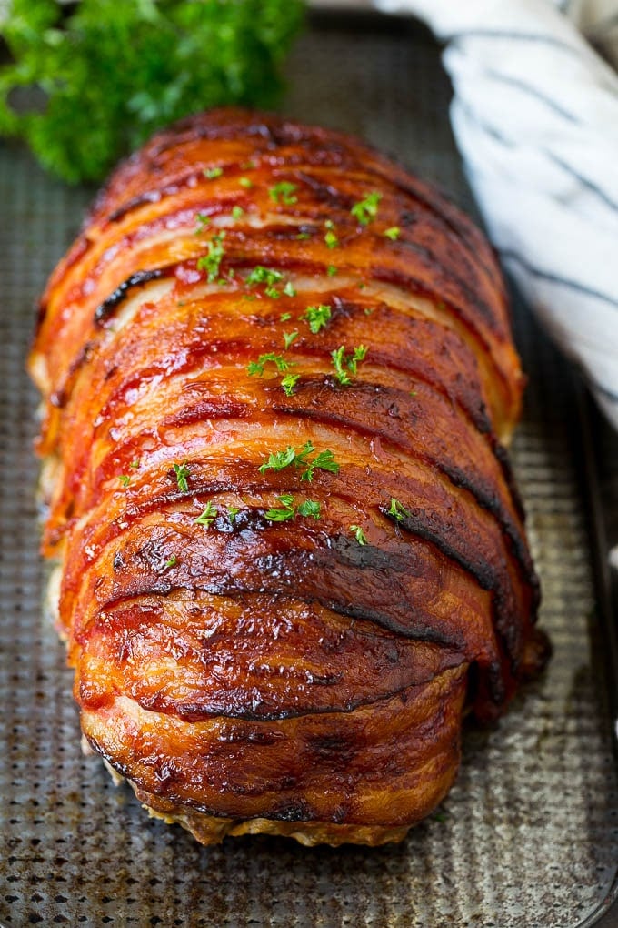 Bacon Wrapped Meatloaf Recipe | Beef Meatloaf #meatloaf #beef #groundbeef #bacon #dinner #sraye Meatloaf wrapped in slices of bacon and baked, then topped with parsley.