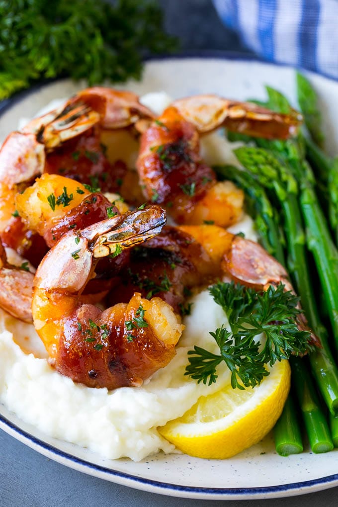 Bacon Wrapped Shrimp Recipe | Bacon Shrimp #shrimp #bacon #appetizer #dinner #sraye #seafood Bacon wrapped shrimp served over mashed potatoes with green beans.
