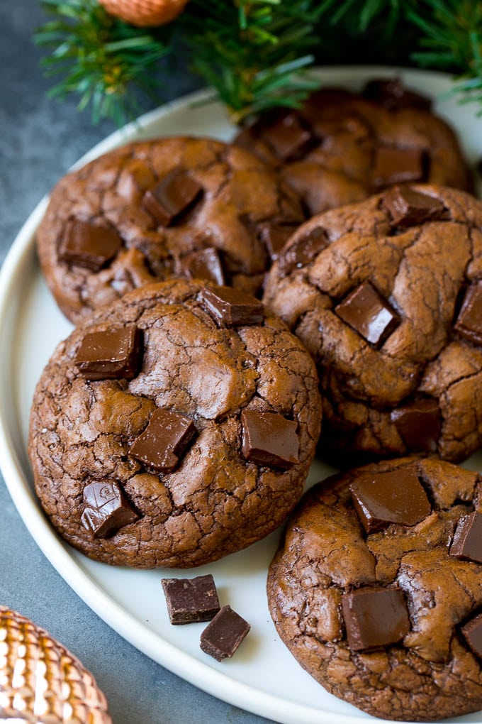 Brownie Cookies Recipe | Chocolate Cookies #cookies #brownies #chocolate #dessert #baking #sraye Brownie cookies on a serving plate, topped with chocolate chunks.