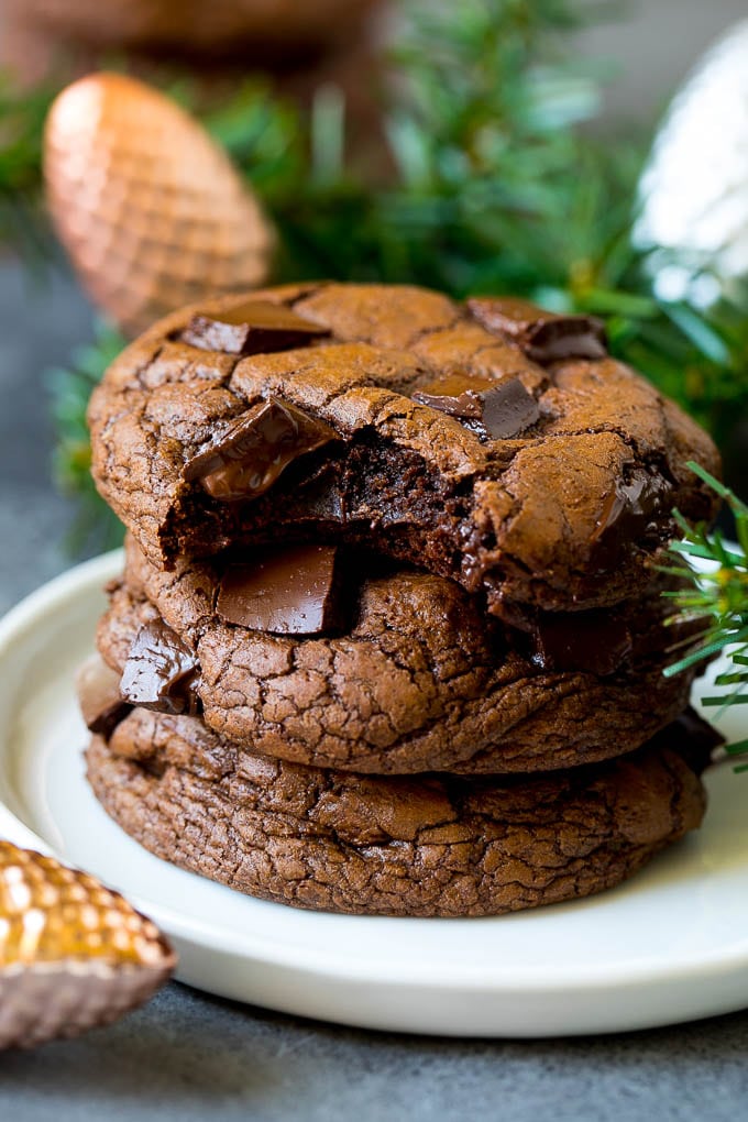 Brownie Cookies Recipe | Chocolate Cookies #cookies #brownies #chocolate #dessert #baking #sraye A stack of brownie cookies with a bite taken out of one.