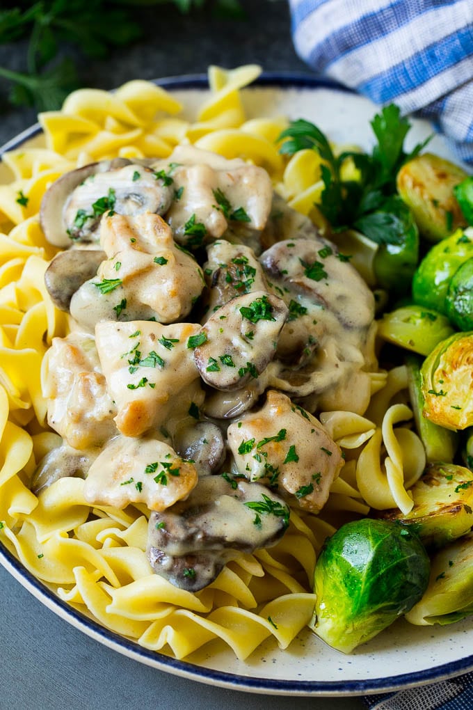 Chicken Stroganoff Recipe | Chicken and Mushrooms #chicken #mushrooms #stroganoff #dinner #sraye Chicken stroganoff over egg noodles with brussels sprouts on the side.