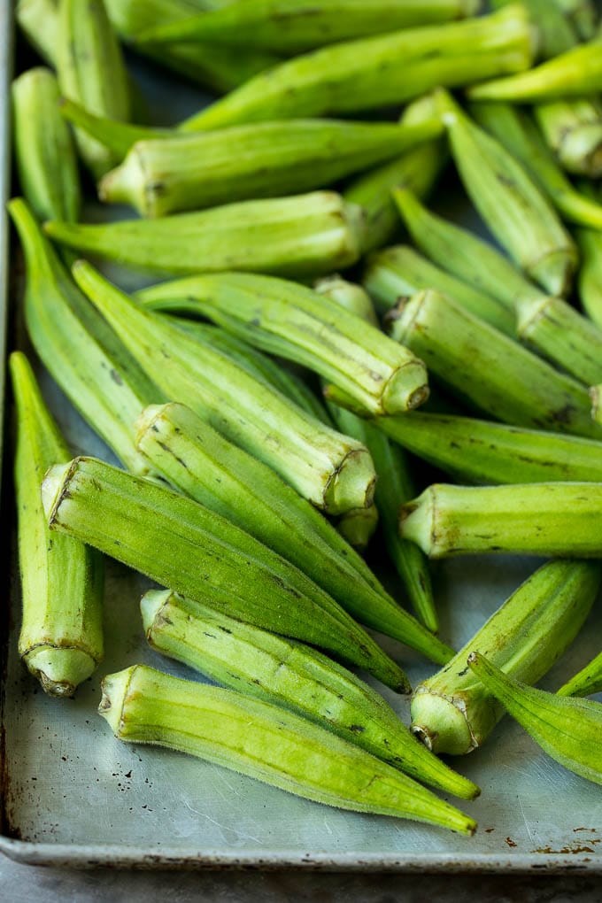 Fried Okra Recipe #okra #appetizer #sidedish #sraye Okra pods on a sheet pan.