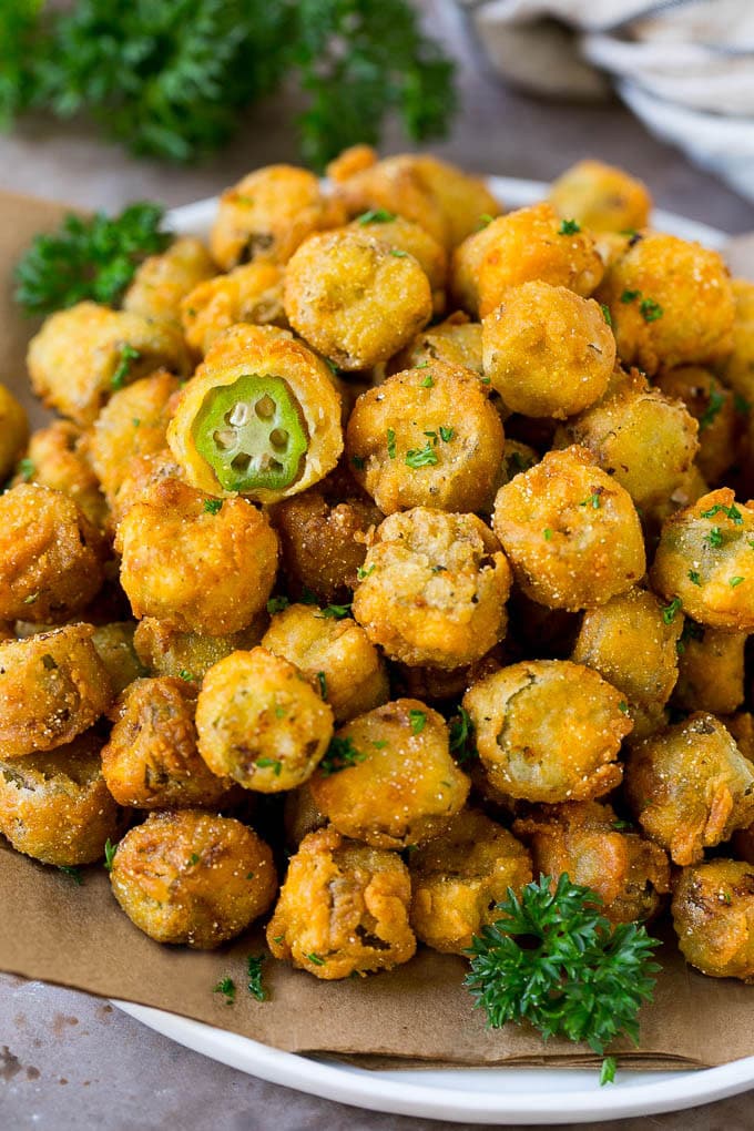 Fried Okra Recipe #okra #appetizer #sidedish #sraye A serving plate of fried okra garnished with parsley.