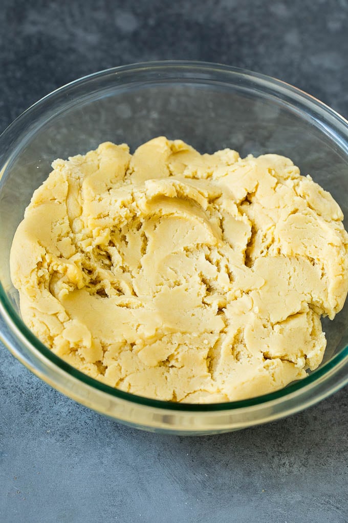 Italian Cookies Recipe | Almond Cookies #cookies #italianfood #frosting #sprinkles #baking #christmas #sraye Almond cookie dough in a mixing bowl.