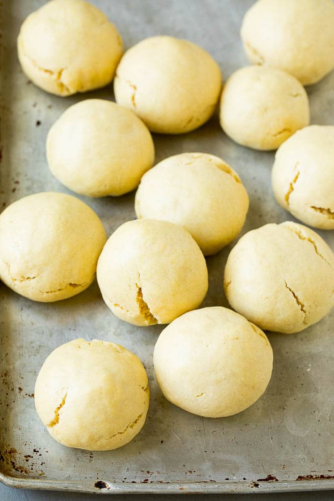 Italian Cookies Recipe | Almond Cookies #cookies #italianfood #frosting #sprinkles #baking #christmas #sraye Baked almond cookies on a baking sheet.