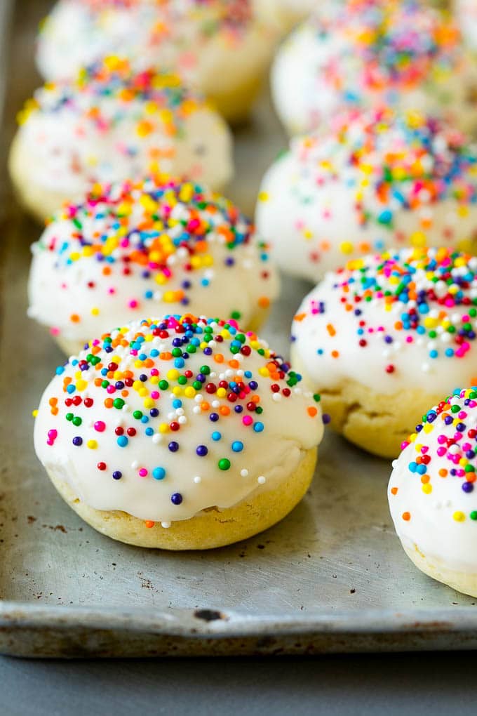 Italian Cookies Recipe | Almond Cookies #cookies #italianfood #frosting #sprinkles #baking #christmas #sraye Italian cookies covered in frosting and rainbow sprinkles.