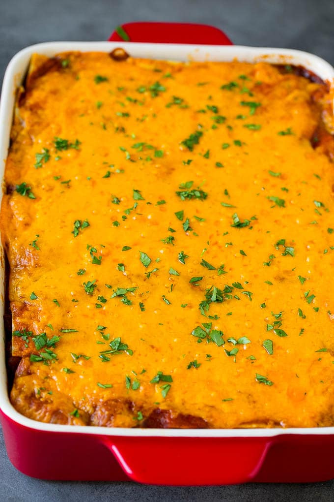 Mexican Lasagna Recipe | Mexican Casserole #mexican #lasagna #groundbeef #beans #dinner #cheese #sraye A baked Mexican casserole topped with melted cheese and cilantro.