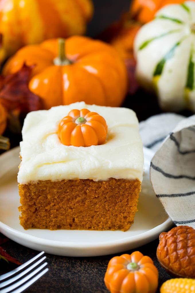 Pumpkin Cake Recipe | Pumpkin Spice Cake #cake #pumpkin #dessert #baking #fall #thanksgiving #sraye A slice of pumpkin cake topped with cream cheese frosting.