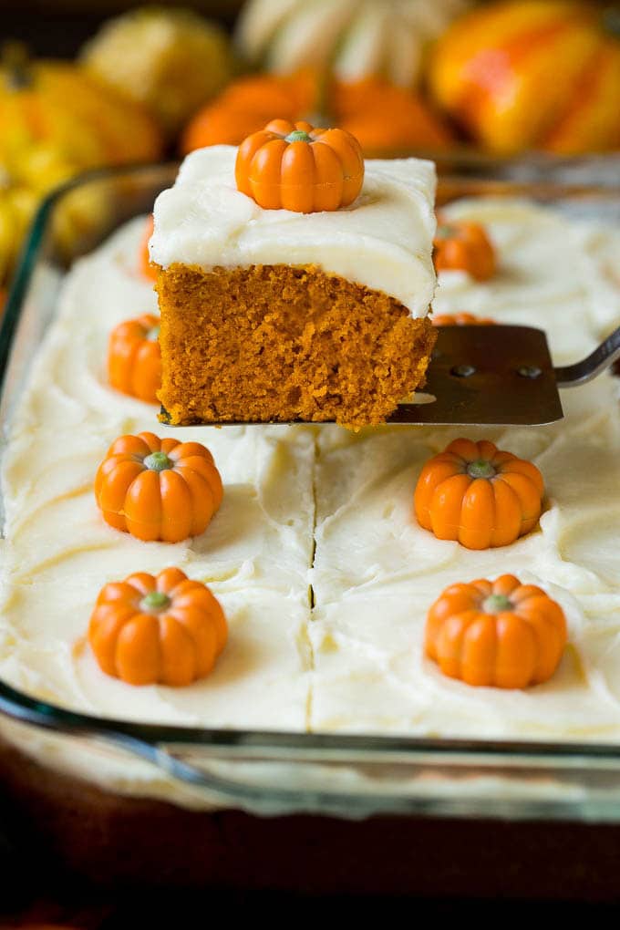 Pumpkin Cake Recipe | Pumpkin Spice Cake #cake #pumpkin #dessert #baking #fall #thanksgiving #sraye A spatula serving up a slice of pumpkin cake.