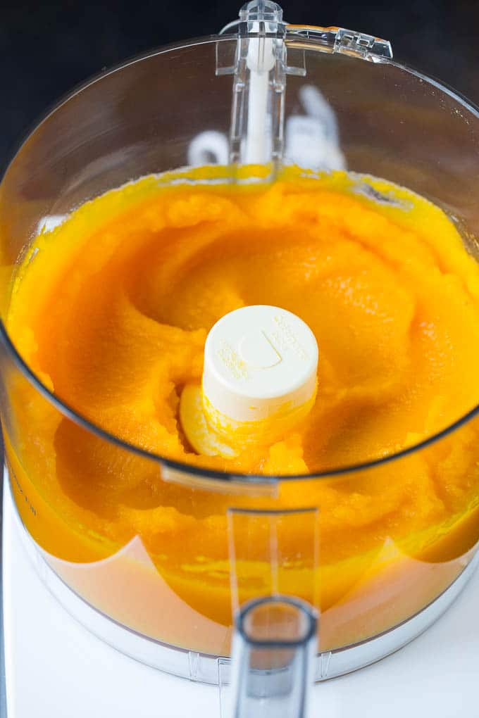 Pumpkin Puree Recipe #pumpkin #baking #fall #thanksgiving #sraye Pureed pumpkin in a food processor.