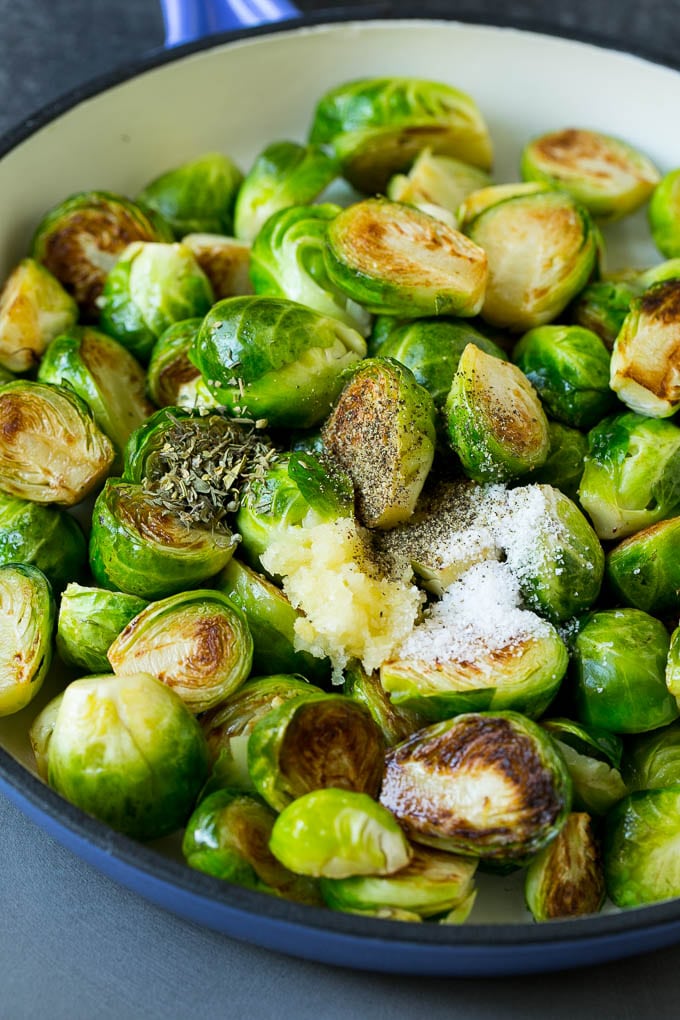 Sauteed Brussels Sprouts Recipe | Brussels Sprouts Side Dish #brusselssprouts #sprouts #veggies #sidedish #garlic #vegetarian #dinner #sraye Sprouts in a pan seasoned with salt, pepper, garlic and dried herbs.