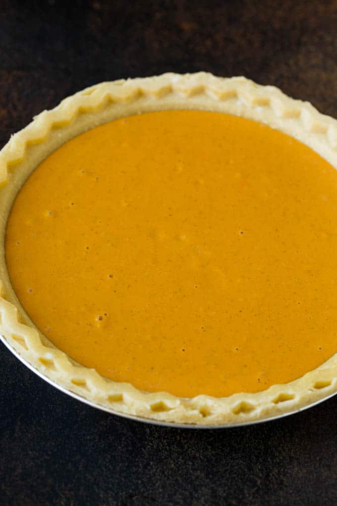 Homemade Pumpkin Pie Recipe | Pumpkin Pie #pie #pumpkin #baking #thanksgiving #fall #dessert #sraye Pie filling inside a pie crust.