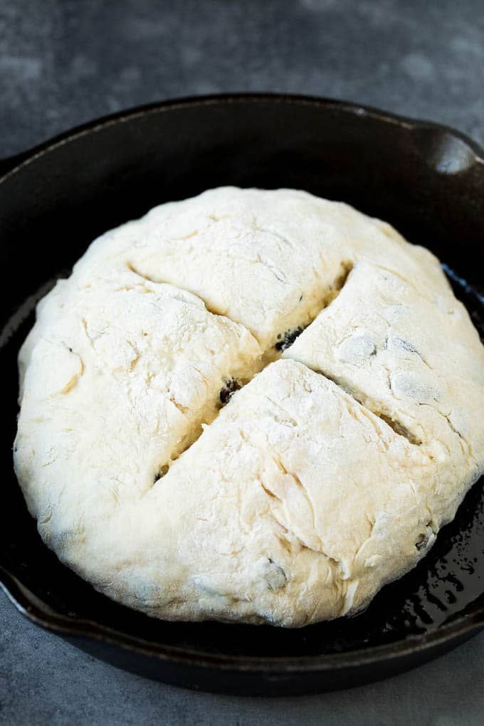 Irish Soda Bread Recipe #bread #baking #stpatricksday #sidedish #sraye A shaped loaf of soda bread in a skillet.