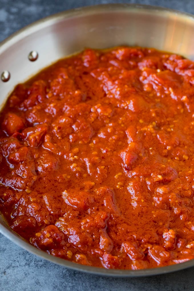Pasta Puttanesca Recipe #pasta #tomatoes #olives #italianfood #dinner #sraye Homemade tomato sauce in a skillet.