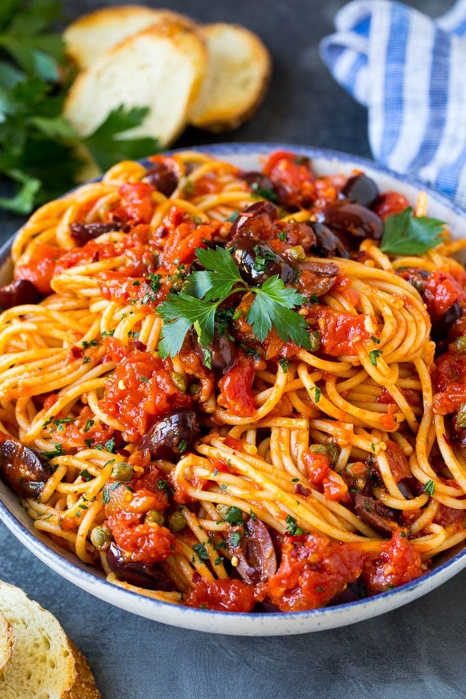 Pasta Puttanesca Recipe #pasta #tomatoes #olives #italianfood #dinner #sraye Pasta puttanesca with spaghetti tossed in a homemade tomato sauce.