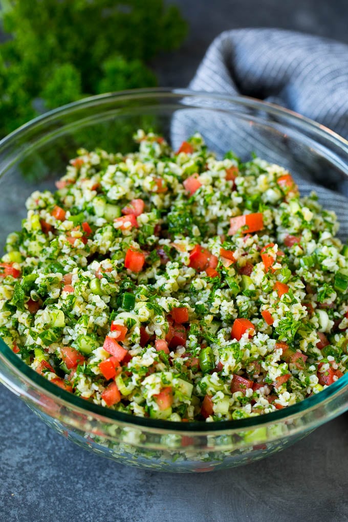 Tabbouleh Salad | Tabouli #salad #wheat #tomatoes #cucumber #healthy #sidedish #dinner #sraye A serving bowl filled with tabbouleh salad.
