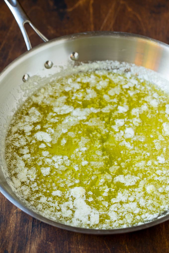 Garlic and Herb Angel Hair Pasta #pasta #garlic #sidedish #dinner #sraye Melted butter with garlic and olive oil in a pan.