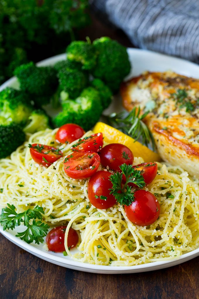 Garlic and Herb Angel Hair Pasta #pasta #garlic #sidedish #dinner #sraye Angel hair pasta served with chicken and broccoli.