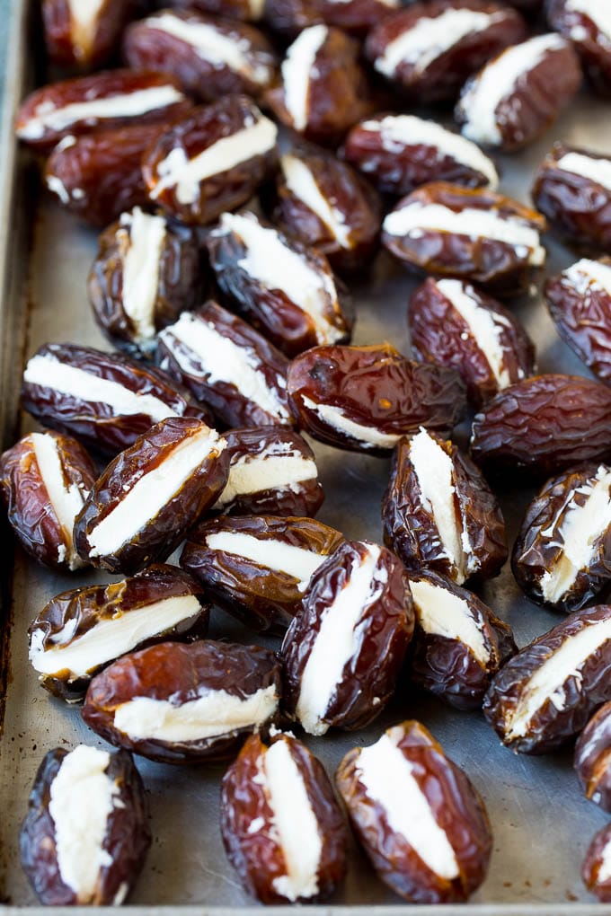 Bacon Wrapped Dates #appetizer #bacon #dates #cheese #sraye Dates cut in half and filled with goat cheese.