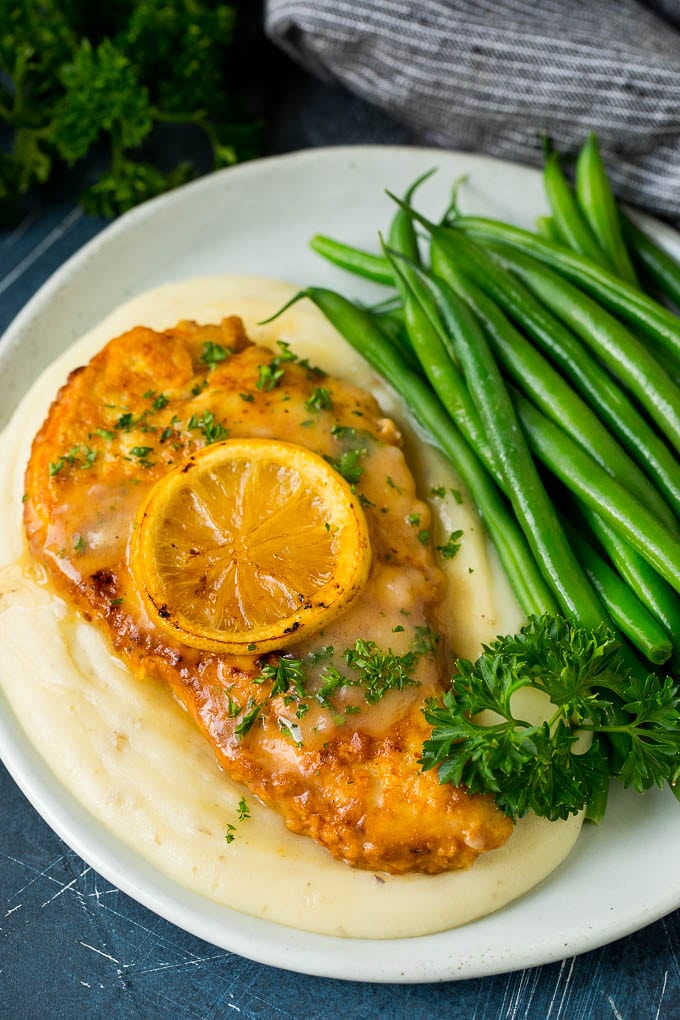 Chicken Francese Recipe #chicken #lemon #dinner #sraye Chicken francese served over mashed potatoes with green beans.
