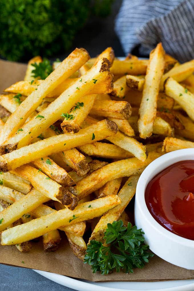 Homemade French Fries Recipe #potatoes #fries #dinner #sraye A plate of homemade french fries served with a bowl of ketchup.