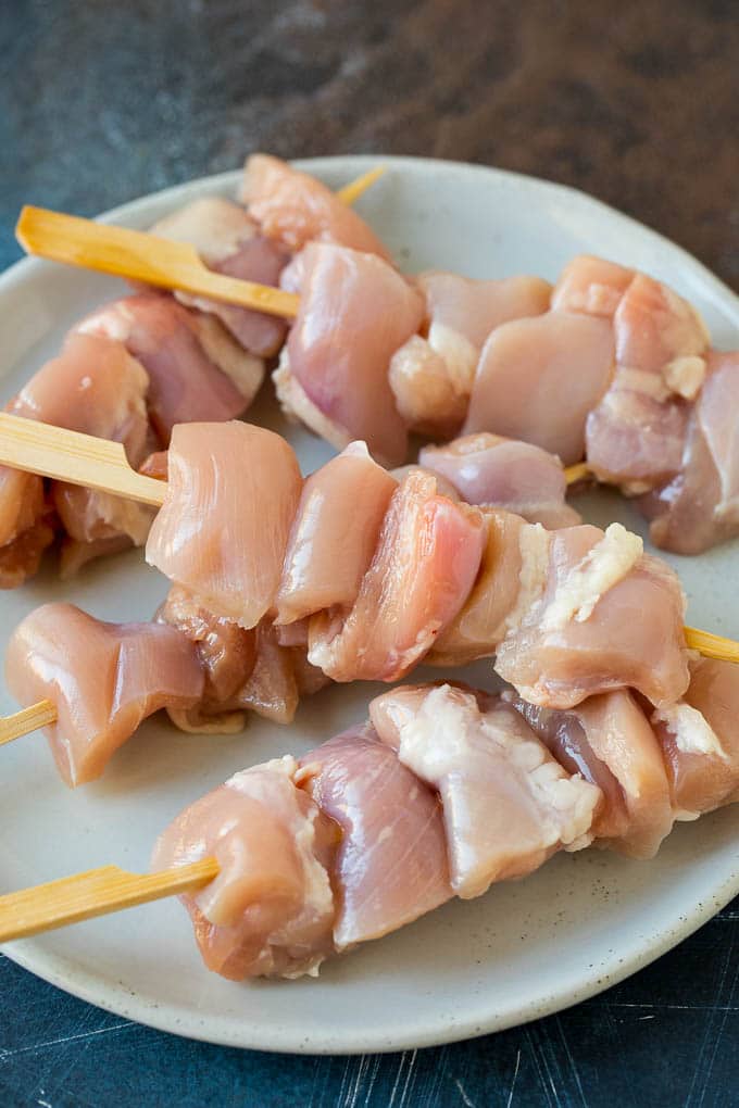 Chicken Yakitori Recipe | Grilled Chicken #chicken #grilling #dinner #sraye Raw chicken threaded onto skewers.