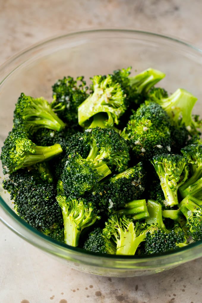 Grilled broccoli is packed with flavor and is a colorful and healthy side dish! #broccoli #sraye Florets tossed with olive oil, garlic and herbs.