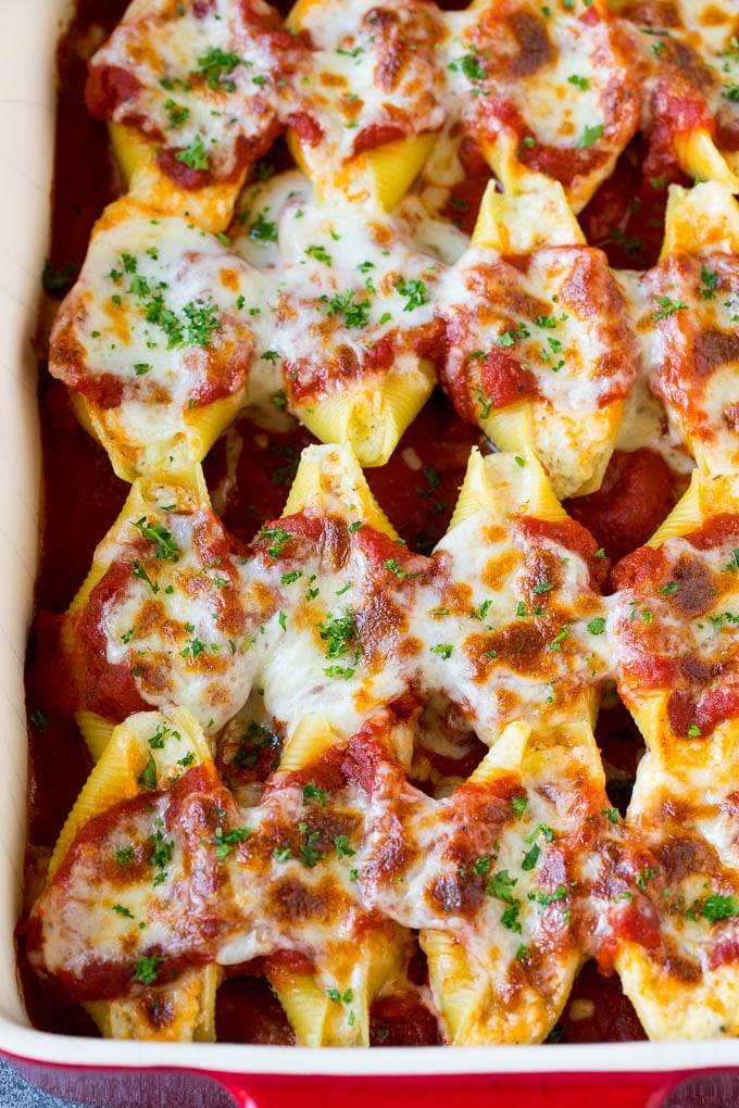 Baked stuffed shells filled with three types of cheese and topped with marinara sauce. #pasta #sraye Baked stuffed shells filled with three types of cheese and topped with marinara sauce.