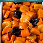 This tzimmes recipe is a colorful stew made with sweet potatoes, carrots and dried fruit.