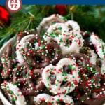 A bowl of chocolate covered pretzels with white chocolate and milk chocolate.
